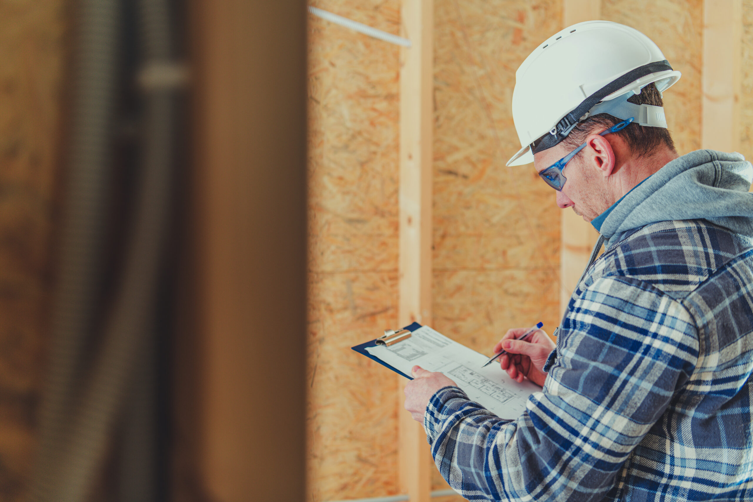 Site Engineer Making Proper Documentation and Checking Building Plans.